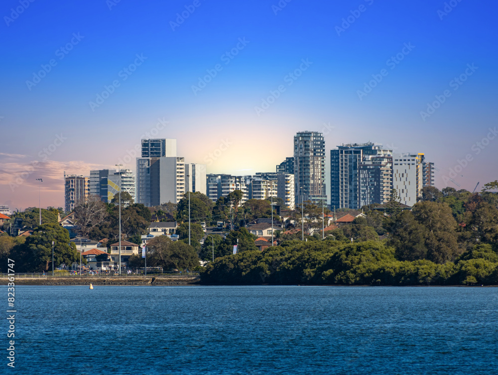 Fototapeta premium Sydney Harbour at Rozelle, Balmain with iron cove bridge and birken head point on parramatta river. Beautiful luxury yachts boats and mansion houses Sydney NSW Australia