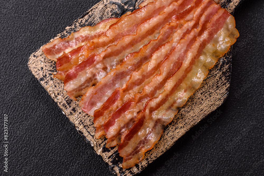 Delicious bacon in the form of slices with salt, spices and herbs Delicious bacon in the form of slices with salt, spices and herbs