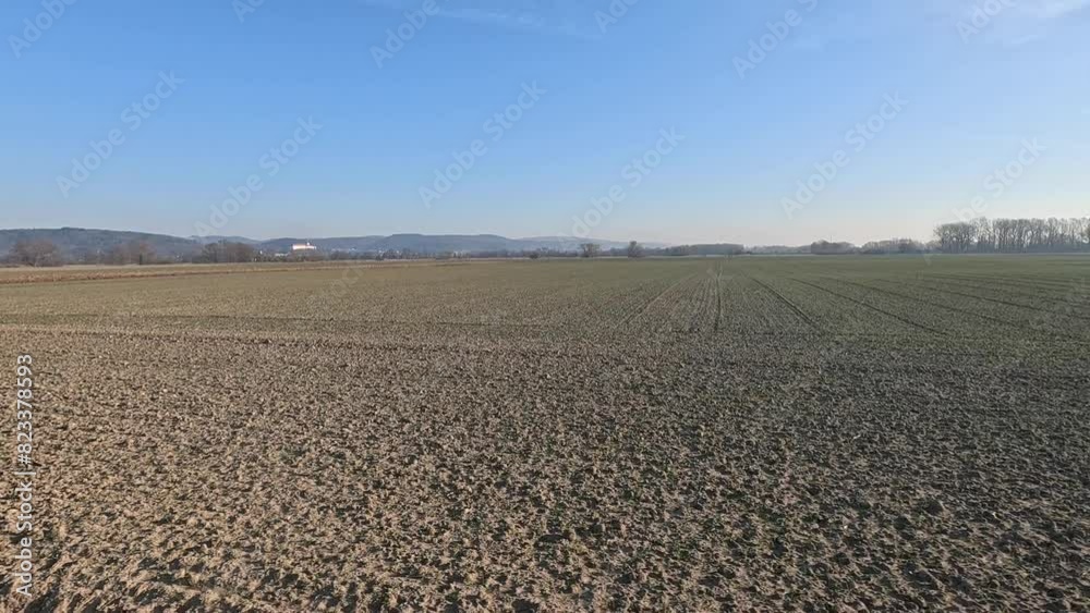 Plowed fields ready for plantation in a rural area with blue dusk sky in the background at sunset Plowed fields ready for plantation in a rural area with blue dusk sky in the background at sunset
