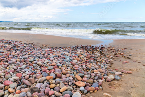 Baltic Sea coast, landscape with shore water and colorful pebble photo
