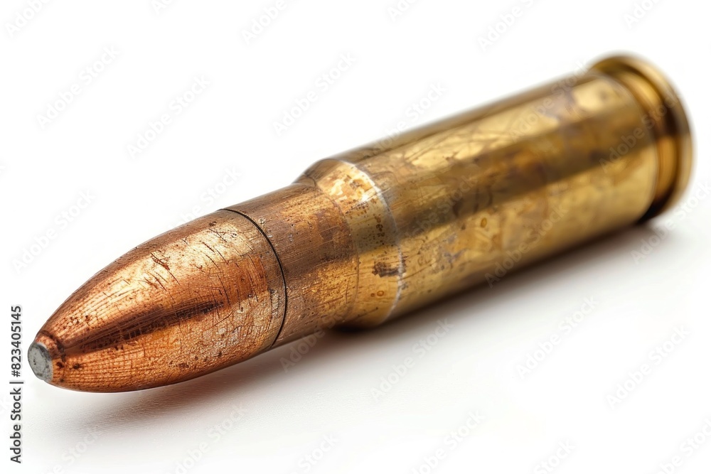 close up view of a single bullet resting on a pristine white background, highlighting its sleek design and potential danger. close up view of a single bullet resting on a pristine white background, highlighting its sleek design and potential danger.