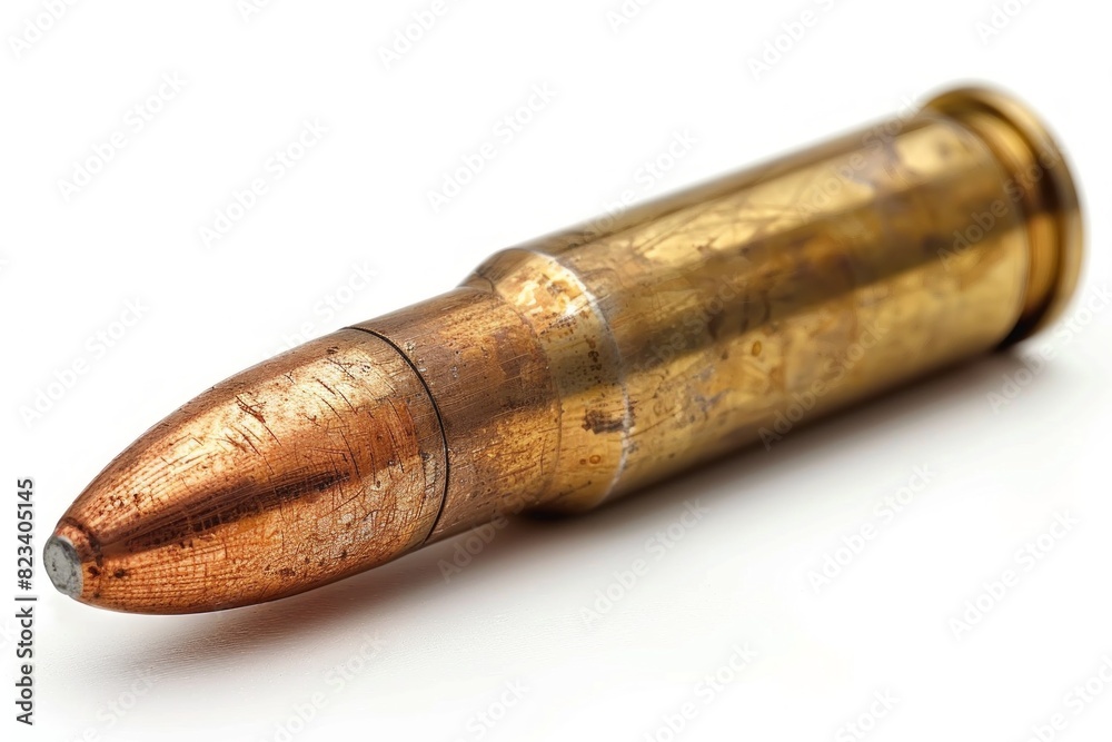 close up view of a single bullet resting on a pristine white background, highlighting its sleek design and potential danger.