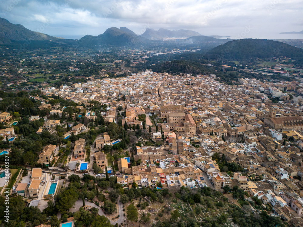 Naklejka premium Aerial view of Pollenca in Mallorca, drone photo in cloudy day