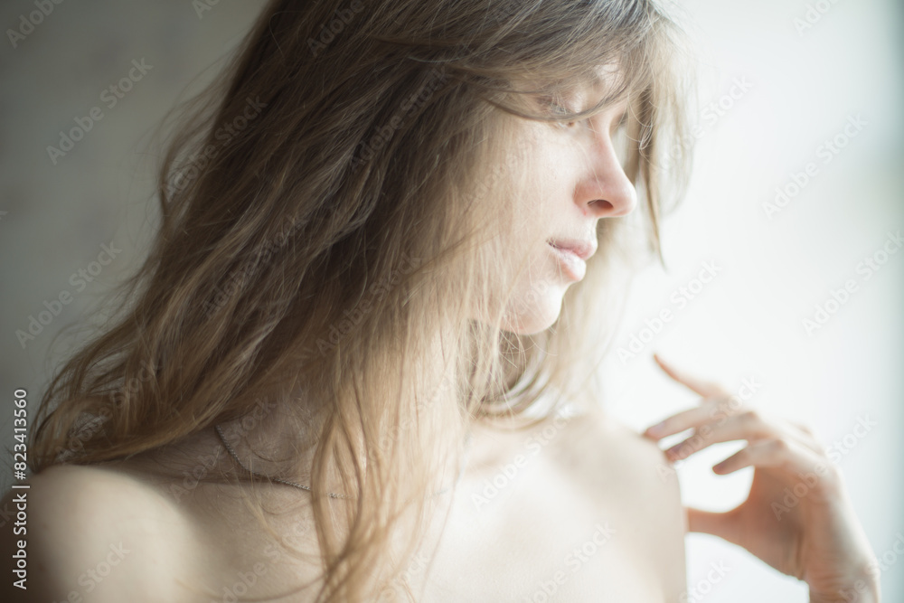 portrait of a girl on a light background long blond hair light skin portrait of a girl on a light background long blond hair light skin