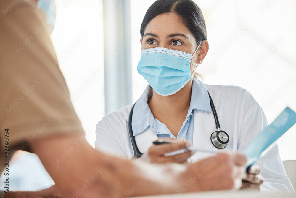 Medical, brochure and doctor with patient in hospital for consulting, health information or virus. Advice, pandemic and physician with mask for disease, protection or covid vaccination in clinic Medical, brochure and doctor with patient in hospital for consulting, health information or virus. Advice, pandemic and physician with mask for disease, protection or covid vaccination in clinic