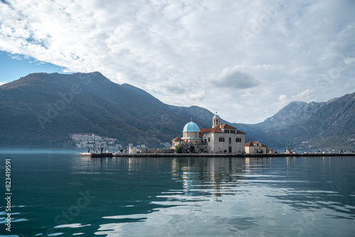 Scenic view of Lady of the Rocks Island with mountain view in the Adriatic Sea in Perast, Montenegro