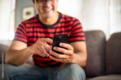man using cell phone holding mobile texting message contact us.chatting,search internet shopping online.technology device communication connecting