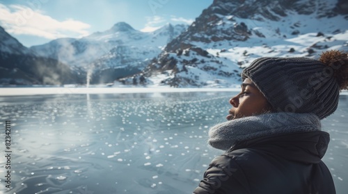Serene Winter Wonderland: Woman Enjoying Mountain Lake Views