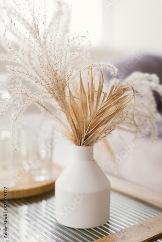 Dry flowers in white vase