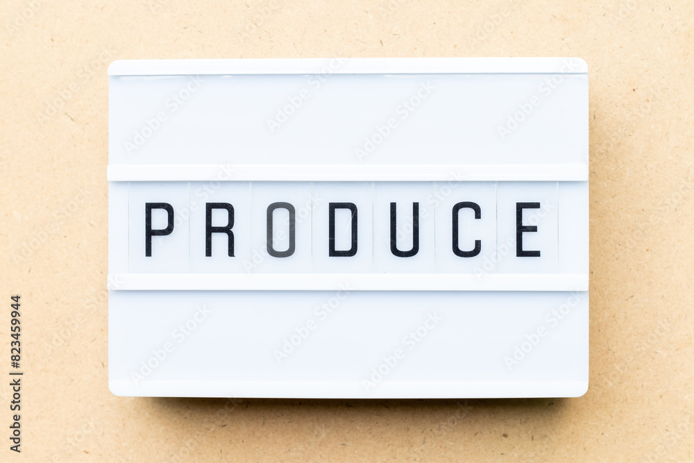 White lightbox with word produce on wood background White lightbox with word produce on wood background