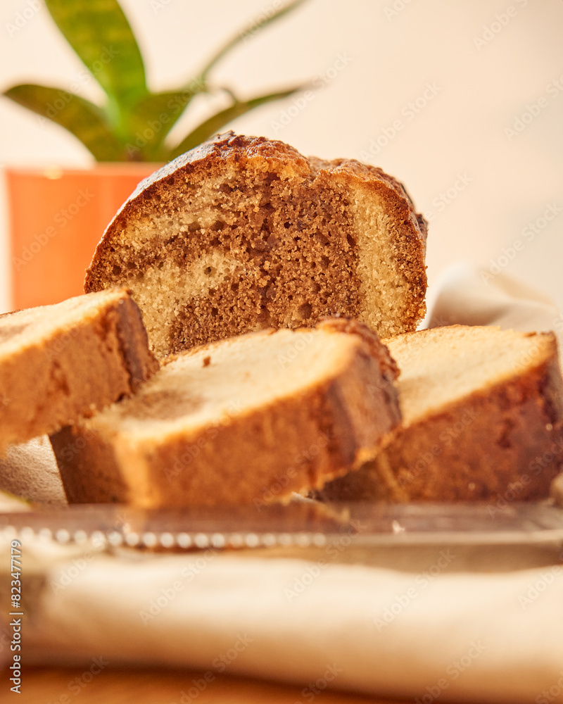 A marbled pudding on a wooden board cut into portions A marbled pudding on a wooden board cut into portions