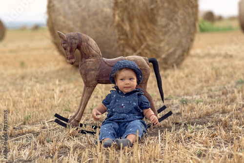 baby girl on field of wheat
