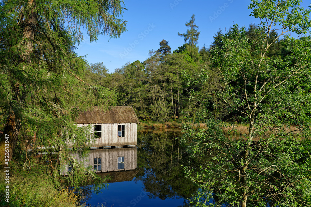 A Traditional wooden Boathouse on the northern margins of the Glen Ogil Reservoir on the Glen Ogil Estate in the Angus Glens. A Traditional wooden Boathouse on the northern margins of the Glen Ogil Reservoir on the Glen Ogil Estate in the Angus Glens.