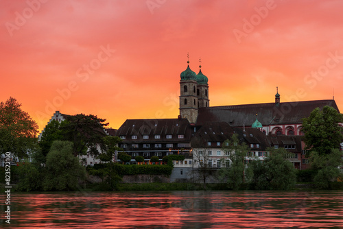 sunset over bad säckingen germany at the river rhine with the historic saint fridolin church photo