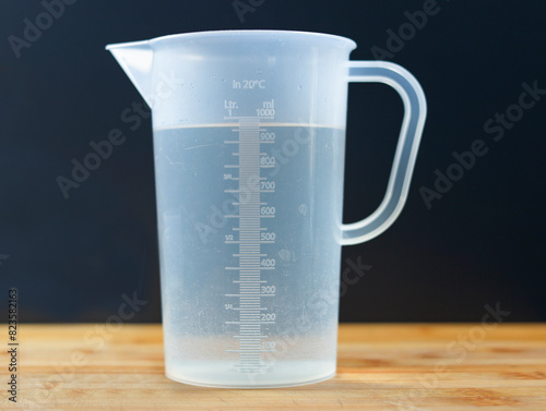 Jug of water, water, measuring cup, ml, milliliter, measuring, 100, liter, full, full jug, full measuring cup.