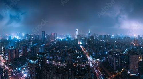 A panoramic view of the city skyline at night, illuminated by modern skyscrapers and streets filled with cars