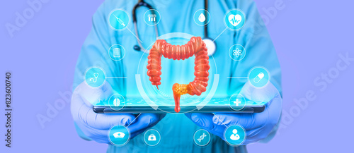 Colon cancer concept. The doctor analyzes the large intestine with tissue damaged by cancer. 3d hologram of the large intestine. GastroenteroloGO with tablet on light lilac background photo