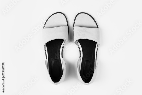 female summer sandals on a white background top view black and white photo