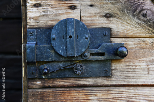 vintage metal lock on a wooden door
