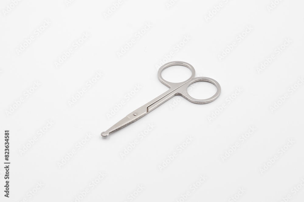 Silver metal scissors on a white background, Scissors for sewing on white background, Very sharp retro professional tailor scissors Silver metal scissors on a white background, Scissors for sewing on white background, Very sharp retro professional tailor scissors