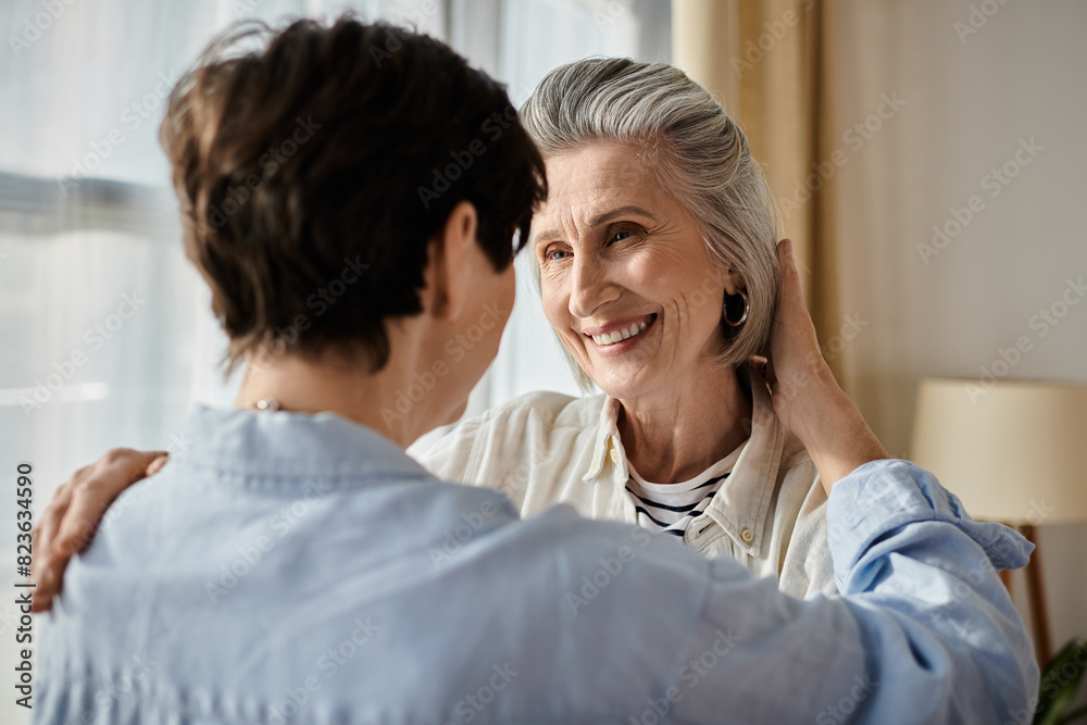A woman lovingly embraces her female partner in a cozy living room. A woman lovingly embraces her female partner in a cozy living room.
