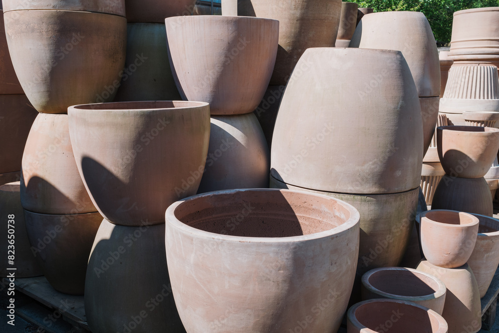 Ceramic terracotta flower pots in different sizes and shapes for sale at the garden center Ceramic terracotta flower pots in different sizes and shapes for sale at the garden center