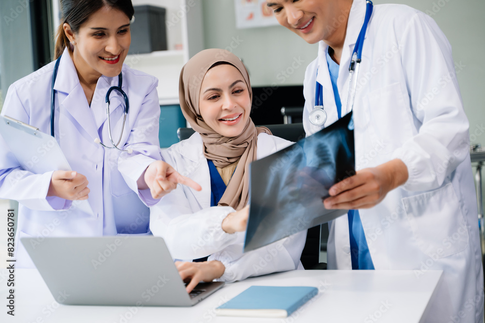 Doctors analyzing results or diagnosis of patient in clinic. Teamwork, medical and healthcare workers in discussion and research on desk in hospital Doctors analyzing results or diagnosis of patient in clinic. Teamwork, medical and healthcare workers in discussion and research on desk in hospital