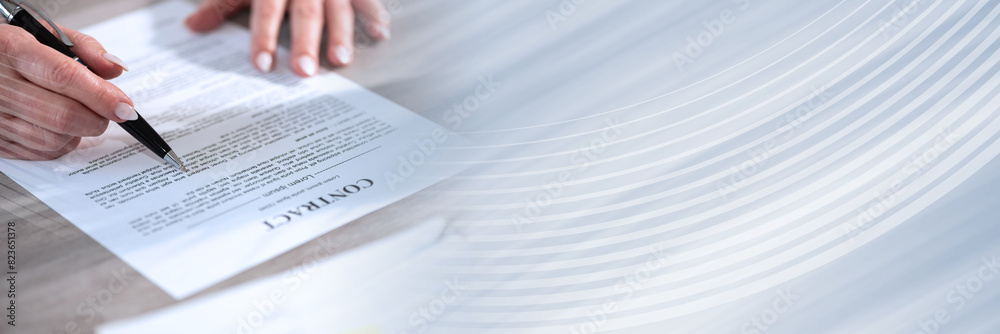 Female hands checking contract; panoramic banner Female hands checking contract; panoramic banner