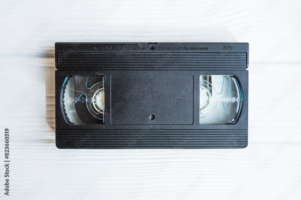 Obraz premium Video cassette tape. Retro videotape with movie.