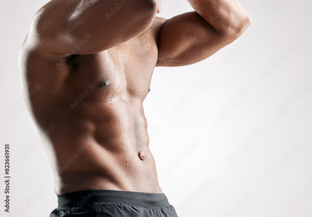 Fototapeta premium Sports, muscles and man with abs stomach in studio for bodybuilding, confidence and exercise. Fitness, mockup and shirtless male person with six pack abdomen and chest for workout by background.