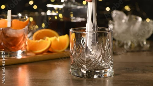 The Sharpie Mustache is a cocktail that's easy to make with equal parts rye whiskey, gin, sweet vermouth and a few drops of bitters, and garnished with a mustache-shaped orange zest. Real time. photo