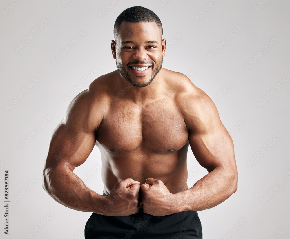 Fototapeta premium Man, flexing and muscle portrait in studio, happy and confident or proud for workout training and exercise for body. White background, mock up and bodybuilder for sports, health and fitness goal