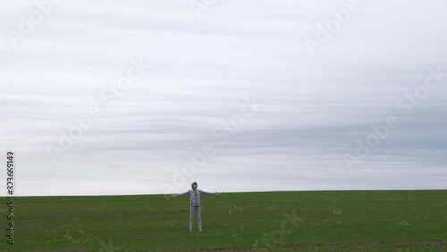 A young and beautiful girl does exercises in nature, yoga, breathing exercises and the like