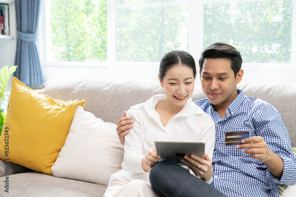 young couple use credit card purchase online at home young couple use credit card purchase online at home