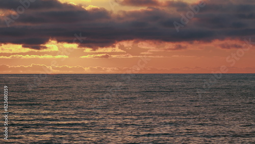 Yellow Orange Sun And Amazing Sea. Big Beautiful Ray Is Reflected On Surface Of Water.