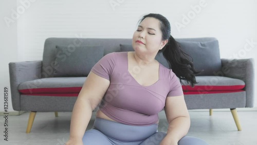 chubby asian woman is bored and lazy to exercise.	