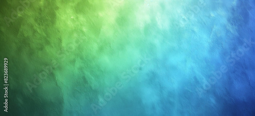 A vibrant abstract texture featuring a smooth gradient transition from green to blue. The texture appears cloud-like, with soft blends of color and a calming atmosphere.