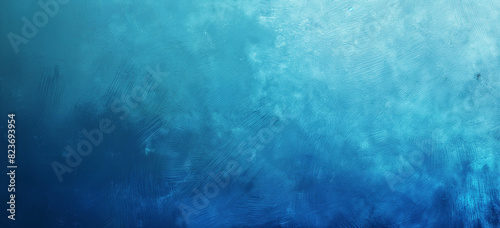 An abstract grunge texture with cool blue tones blending from light to deep navy. The cloudy, textured surface creates a calming, oceanic effect, ideal for backgrounds, designs, or artistic projects