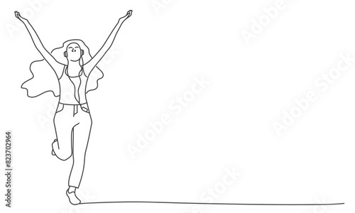 A woman is jumping in the air with her arms outstretched