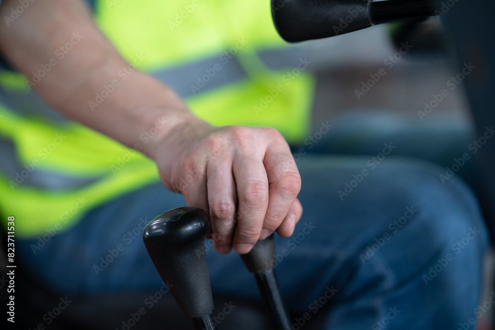 Fototapeta premium person driving forklift in factory