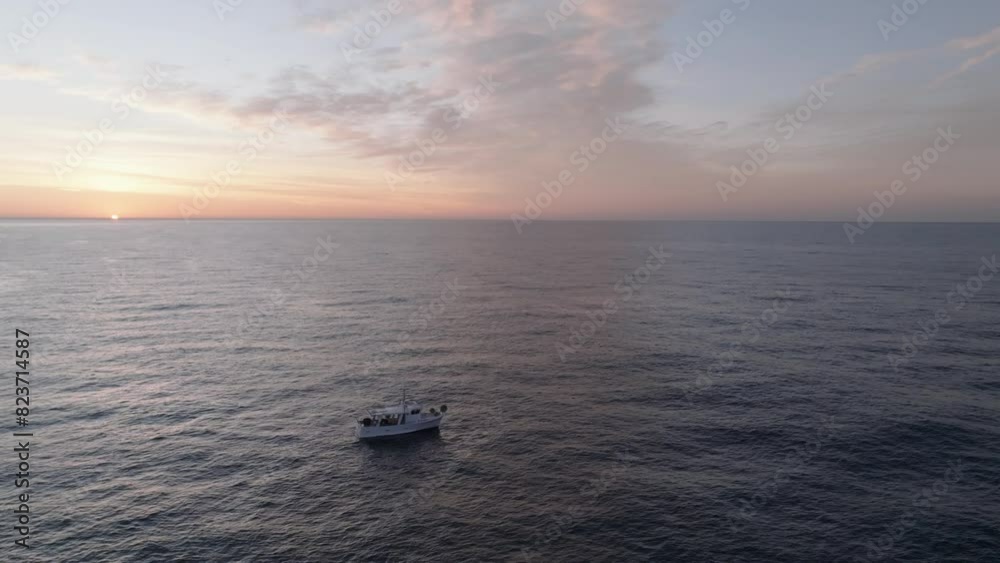 Mediterranean sea at sunset. Dramatic sky with glowing golden pink clouds, reflections in the water. Mediterranean sea at sunset. Dramatic sky with glowing golden pink clouds, reflections in the water.