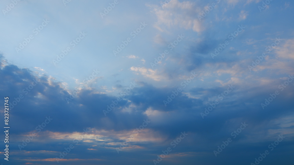 Texture of bright evening sky during sunset. Background of clouds on the burning dawn. Timelapse.