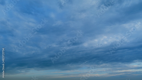 White and gray clouds fly across the sky and change shape. Clearing day and good windy weather. Timelapse.