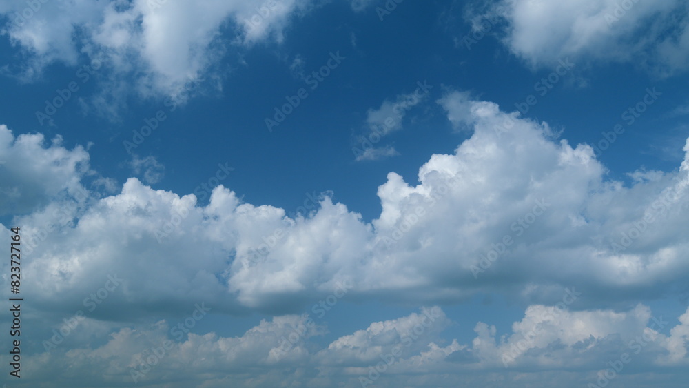 Clouds move in the blue sky. Running clouds against the blue sky. Timelapse.