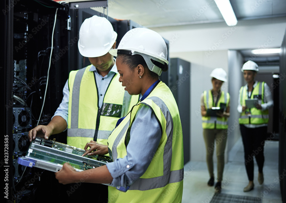Motherboard, woman and man as data engineer in programming in communication center in teamwork or collaboration. People, tech and hardware for security in server room for system update or maintenance Motherboard, woman and man as data engineer in programming in communication center in teamwork or collaboration. People, tech and hardware for security in server room for system update or maintenance