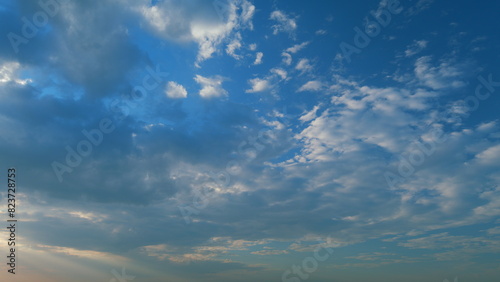 Cirrocumulus cloud in evening. Beautiful and relaxing clouds with a dark blue afternoon sky. Timelapse. photo