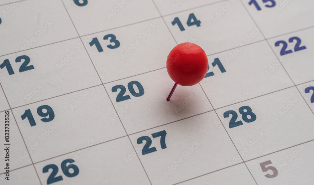 calendar with a red pin marked on the 20th of the month. Planning on 20th.. twentieth day of the month on the calendar marked calendar with a red pin marked on the 20th of the month. Planning on 20th.. twentieth day of the month on the calendar marked