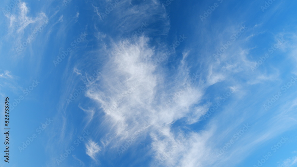 Blue sky with beautiful clouds. Beautiful sunny blue sky background with cirrus clouds. Timelapse.