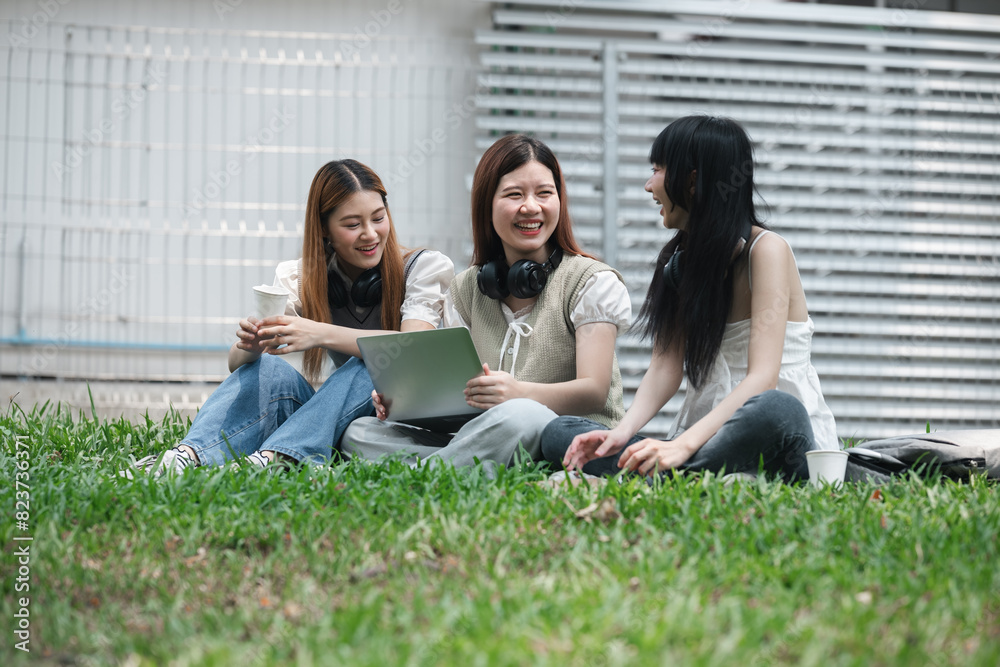 University students studying and laughing together on campus lawn. Group of young friends enjoying outdoor learning and bonding. Concept of education, friendship, and student life University students studying and laughing together on campus lawn. Group of young friends enjoying outdoor learning and bonding. Concept of education, friendship, and student life