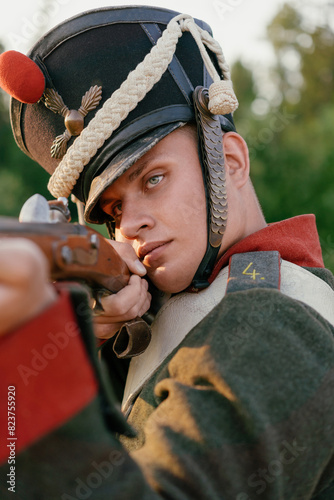  Portrait of a soldier with a weapon in his hands